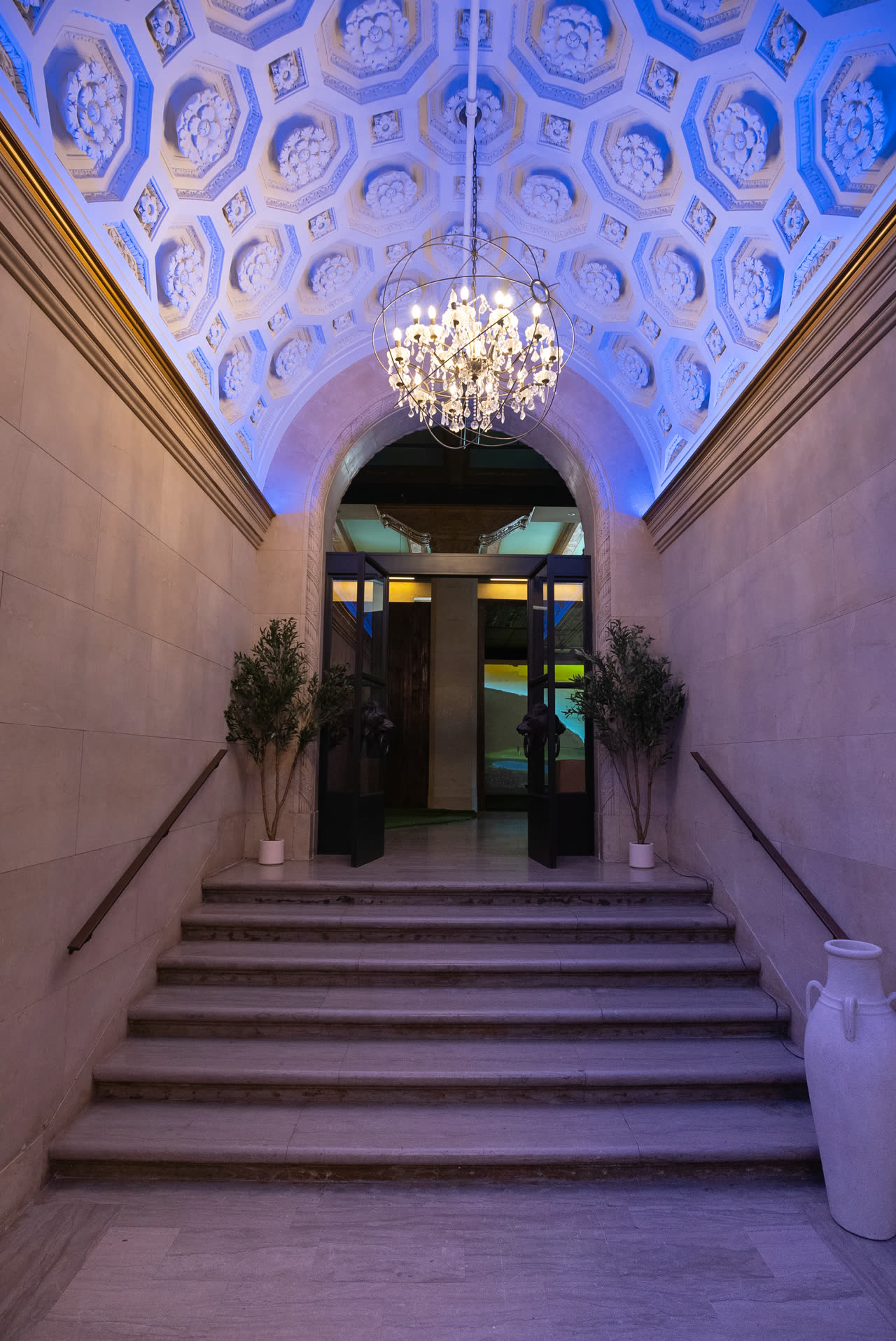 The entrance stair and chandelier at The Philadelphia Golf Club